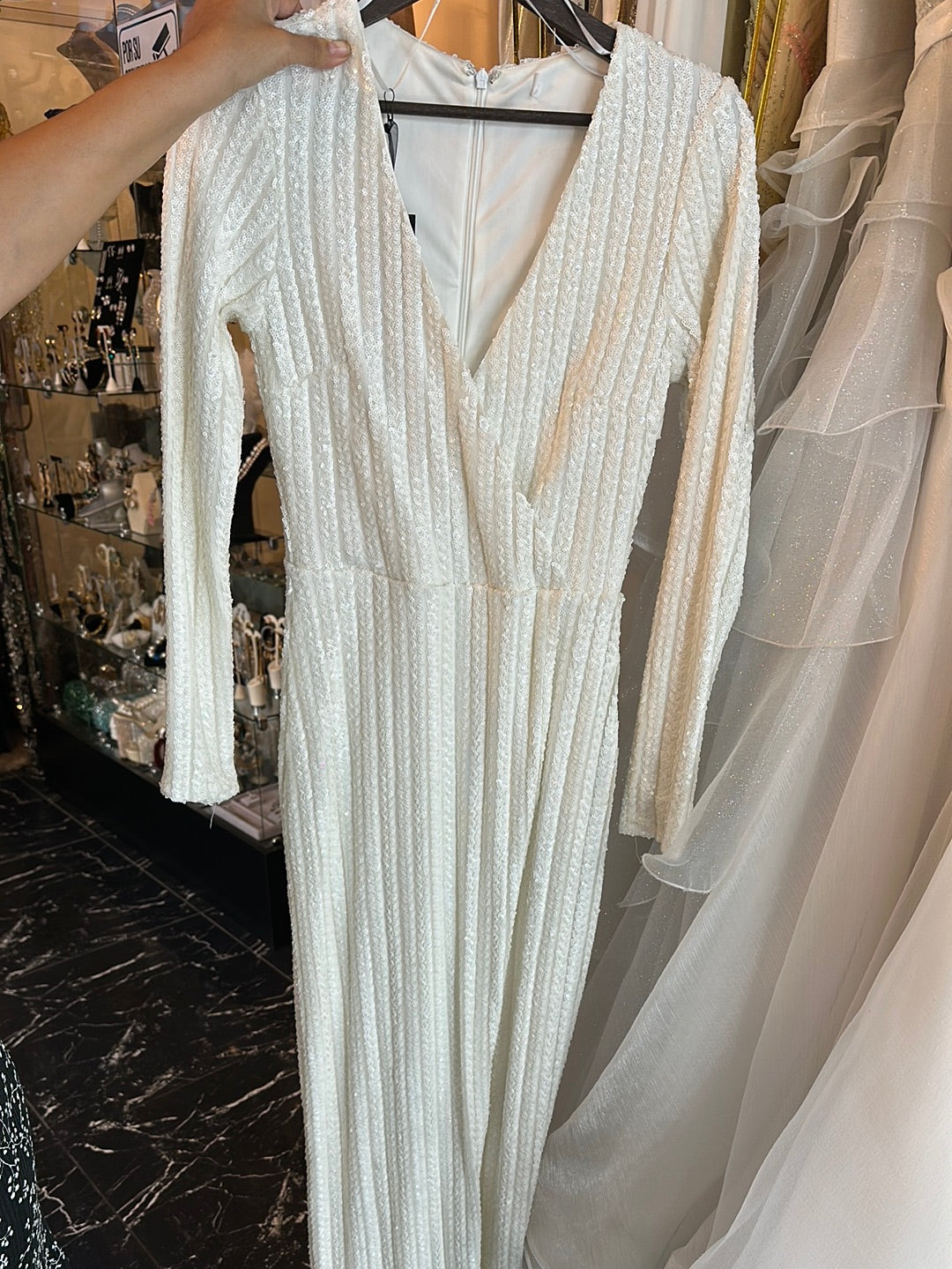 Sparkling White Wrap: A Glittering Sequin Gown with Long Sleeves