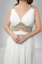Golden Elegance: V-Neck White Gown with Gilded Waist Detail
