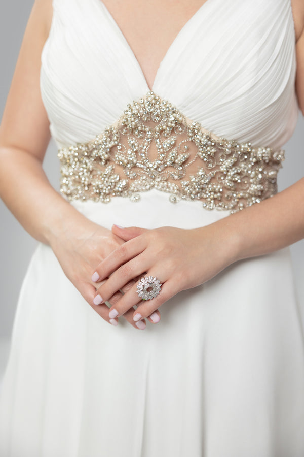 Golden Elegance: V-Neck White Gown with Gilded Waist Detail