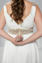 Dazzling Visions: V-Neck White Gown with Golden Crystal Accents and Back Draping