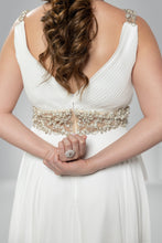 Golden Elegance: V-Neck White Gown with Gilded Waist Detail