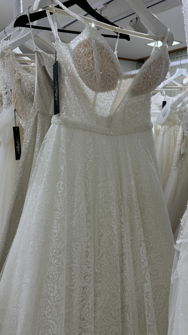 Vestido de novia linea A de corse transparente y falda de shimmer floral