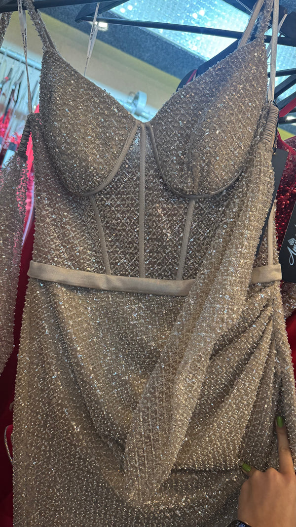 Shining in corseted beige and sliver dress