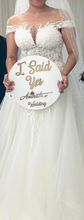Vestido de novia linea A con cuello transparente y detalles de perlas